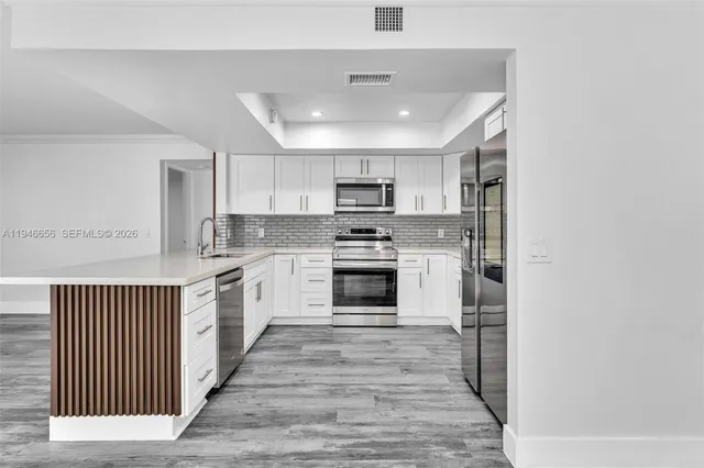 a house with palm tree in front of it
