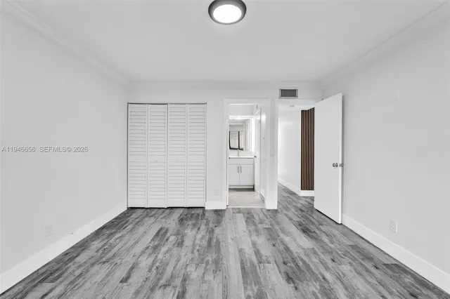 a bathroom with a granite countertop sink a mirror and a bathtub