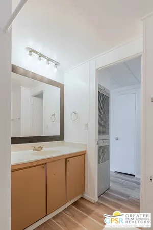 a view of cabinets with wooden floor