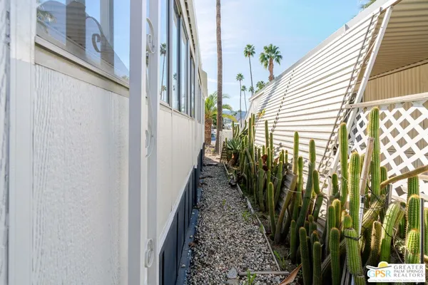 a view of a pathway of a house with a door and pathway