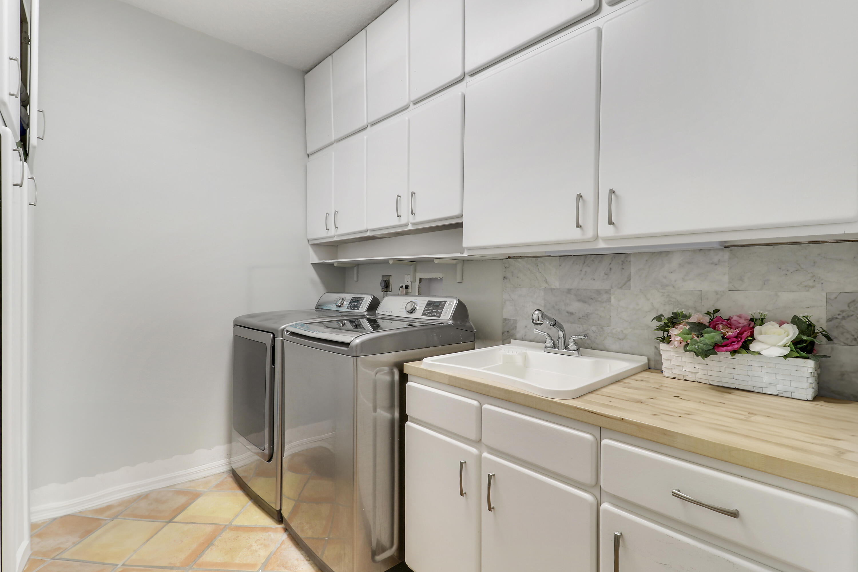 204 Chinook Lane Jupiter, FL 33458 - Photo 16 of 30 a kitchen with a sink cabinets and a window