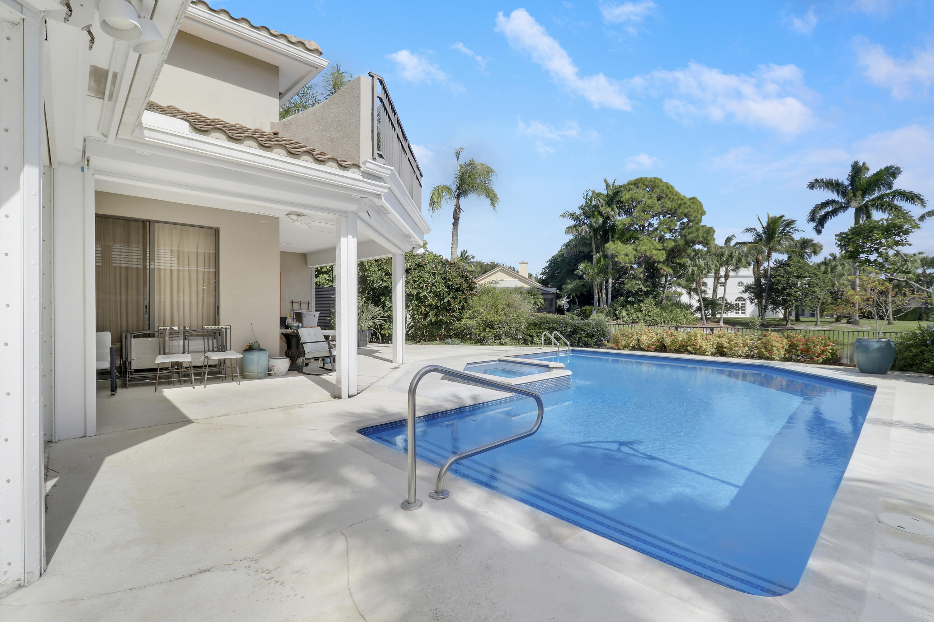 204 Chinook Lane Jupiter, FL 33458 - Photo 17 of 30 a view of swimming pool with outdoor seating and plants