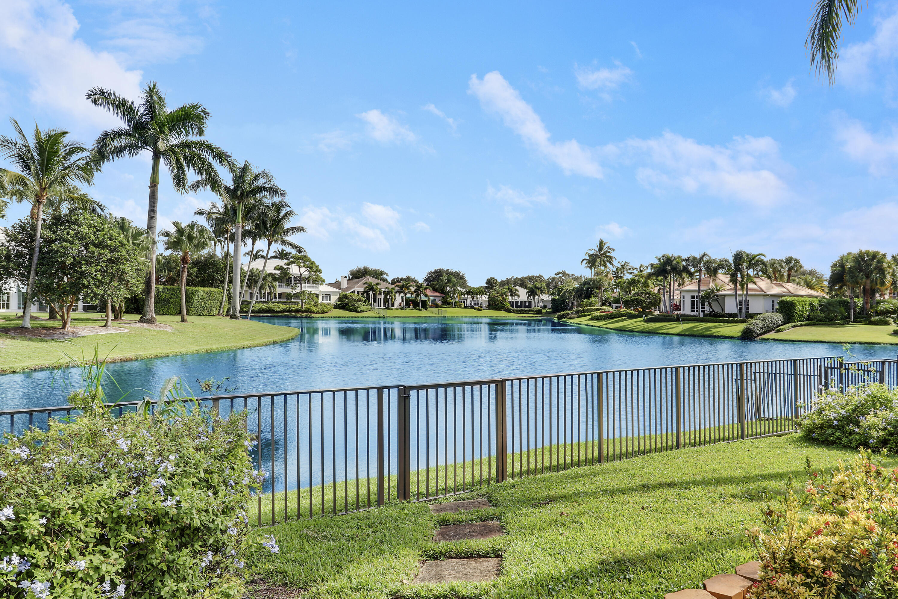 204 Chinook Lane Jupiter, FL 33458 - Photo 20 of 30 a view of a lake with a garden