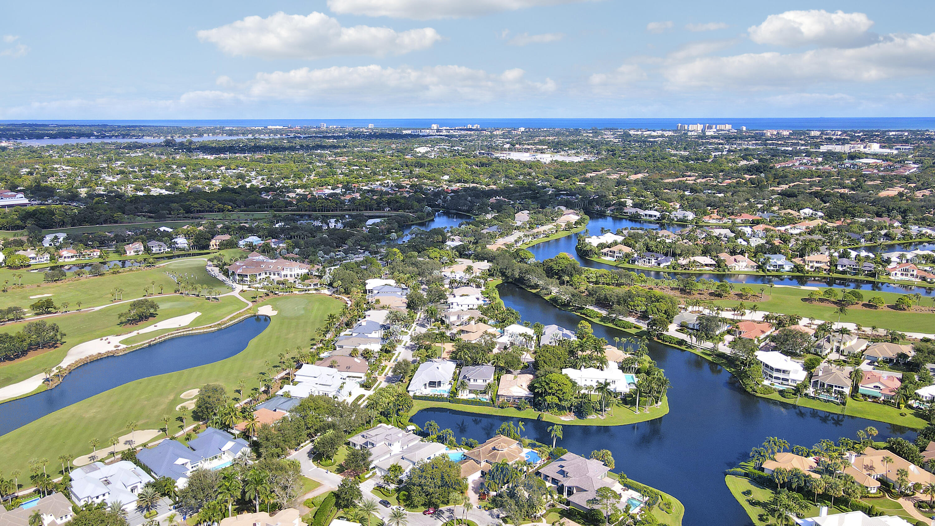 204 Chinook Lane Jupiter, FL 33458 - Photo 25 of 30 an aerial view of a houses with a lake