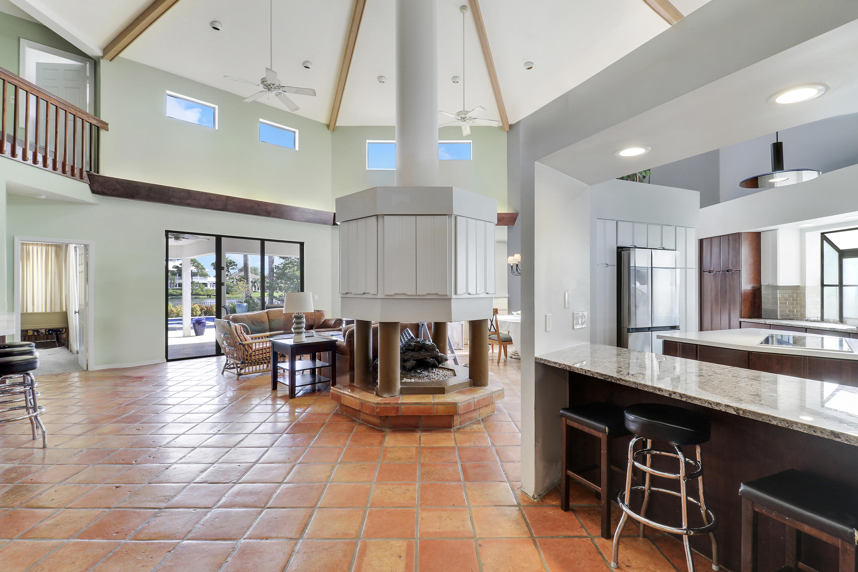204 Chinook Lane Jupiter, FL 33458 - Photo 7 of 30 a dining hall with stainless steel appliances granite countertop a stove and a view of living room