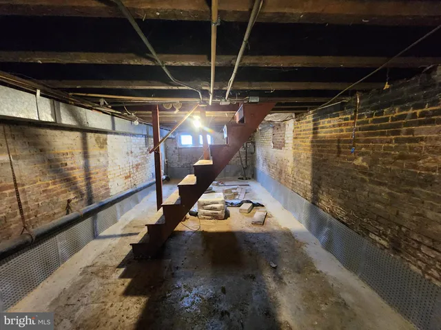 a view of a storage room with wooden floor