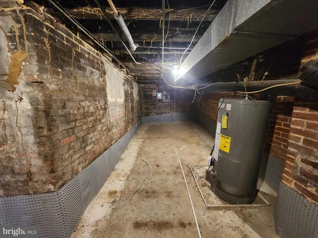 a view of a street with cars parked in front of it