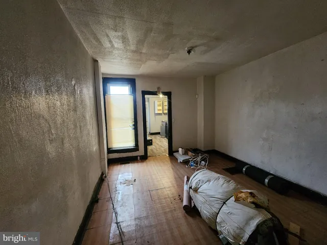 a spacious bedroom with a bed and a shower