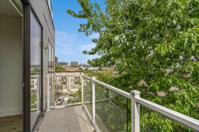 a view of balcony with furniture