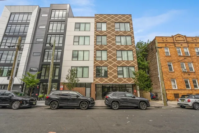 two cars parked in front of a building