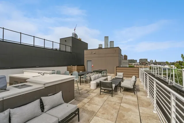 a terrace with a table and chairs