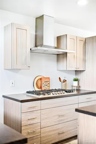 a kitchen with white cabinets and a sink