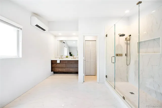 a bathroom with a tub and a shower