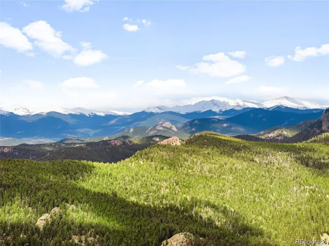 a view of mountain with a lake view