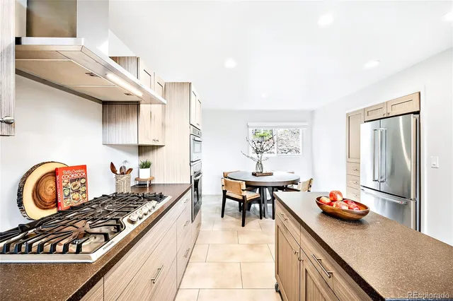 a kitchen with granite countertop a stove and a sink