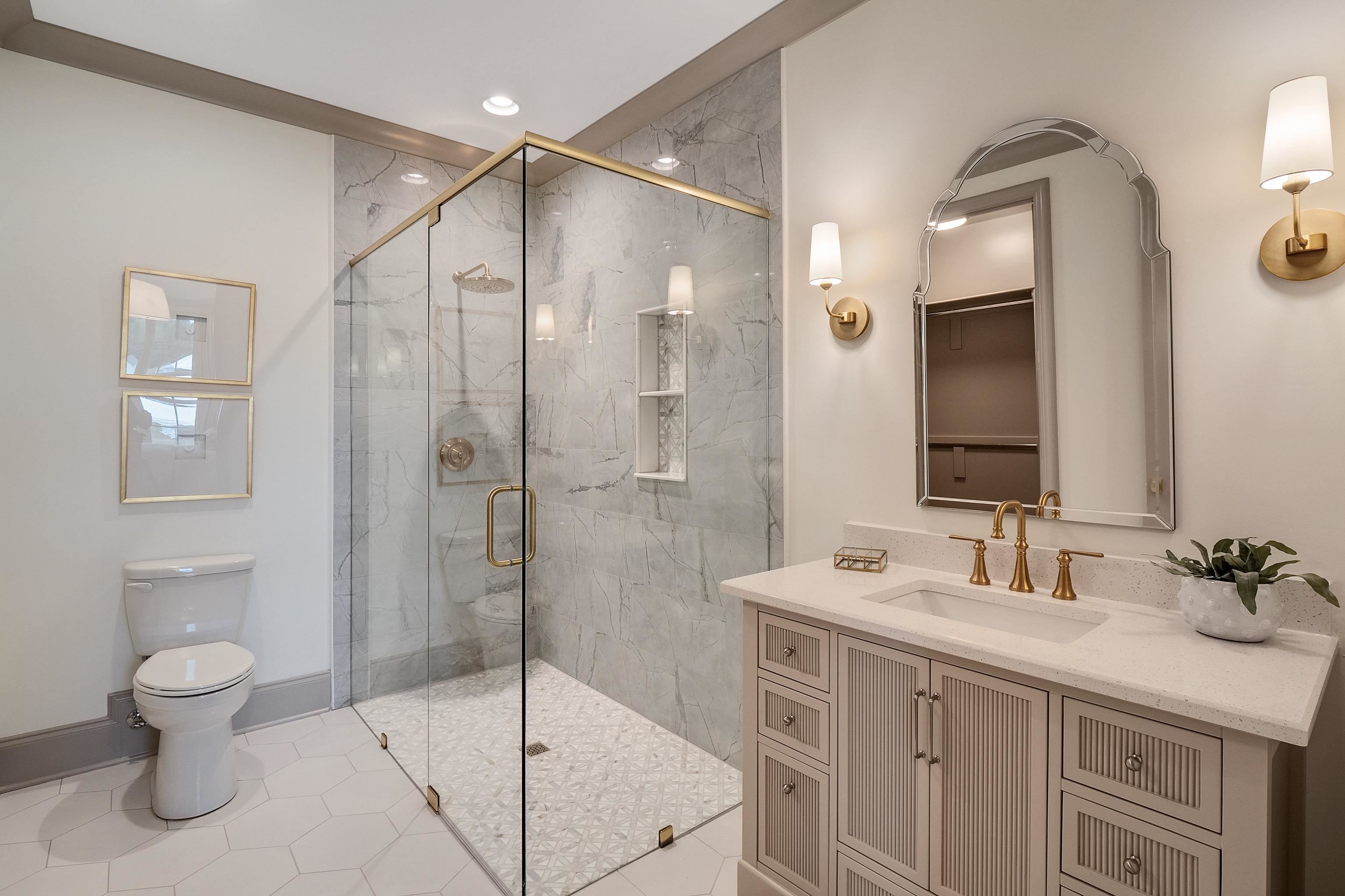 356 River Branch Drive Collierville, TN 38017 - Photo 13 of 31 a bathroom with a granite countertop sink a toilet and shower