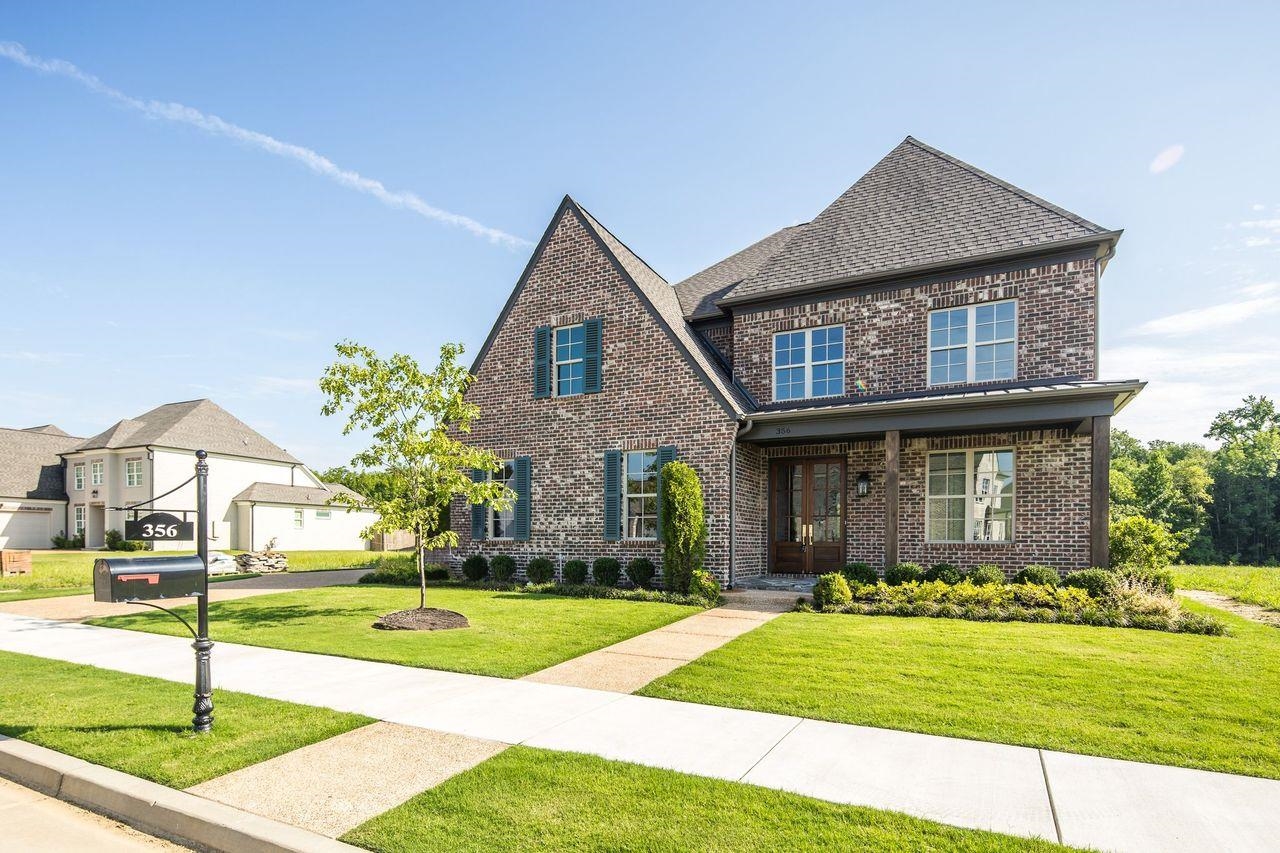 356 River Branch Drive Collierville, TN 38017 - Photo 2 of 31 a front view of a house with a yard