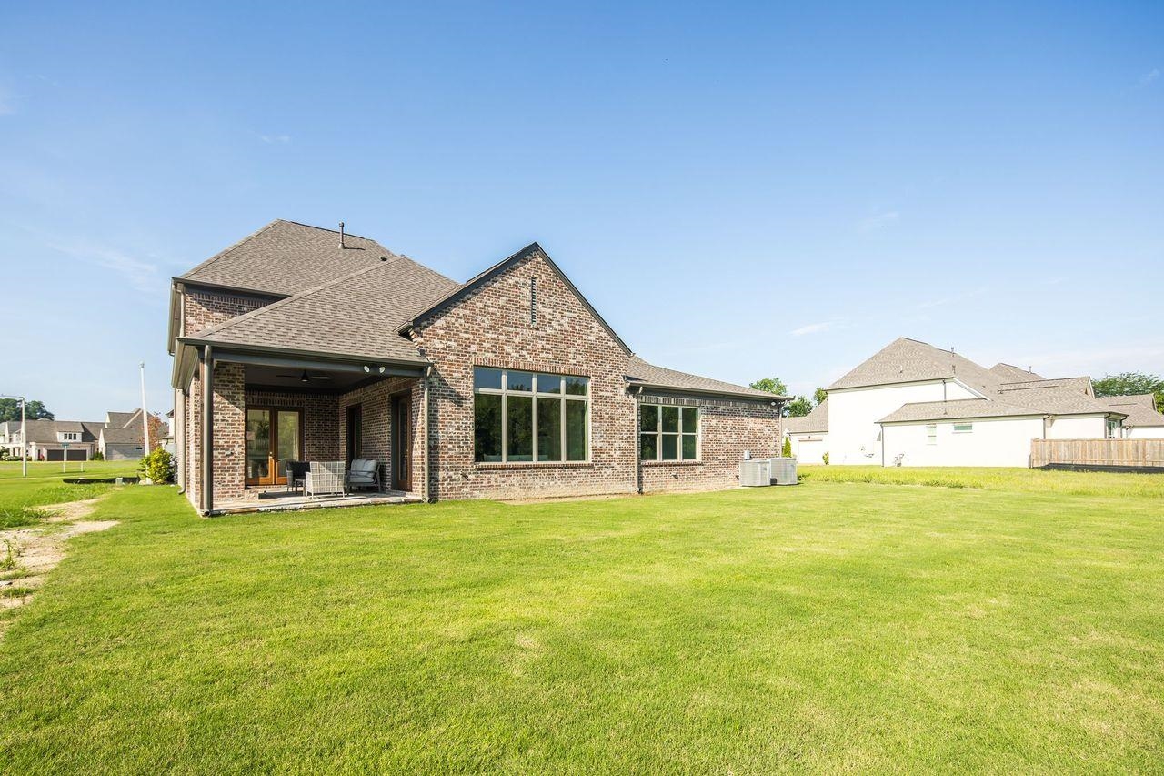 356 River Branch Drive Collierville, TN 38017 - Photo 27 of 31 a view of a house with a big yard and large trees