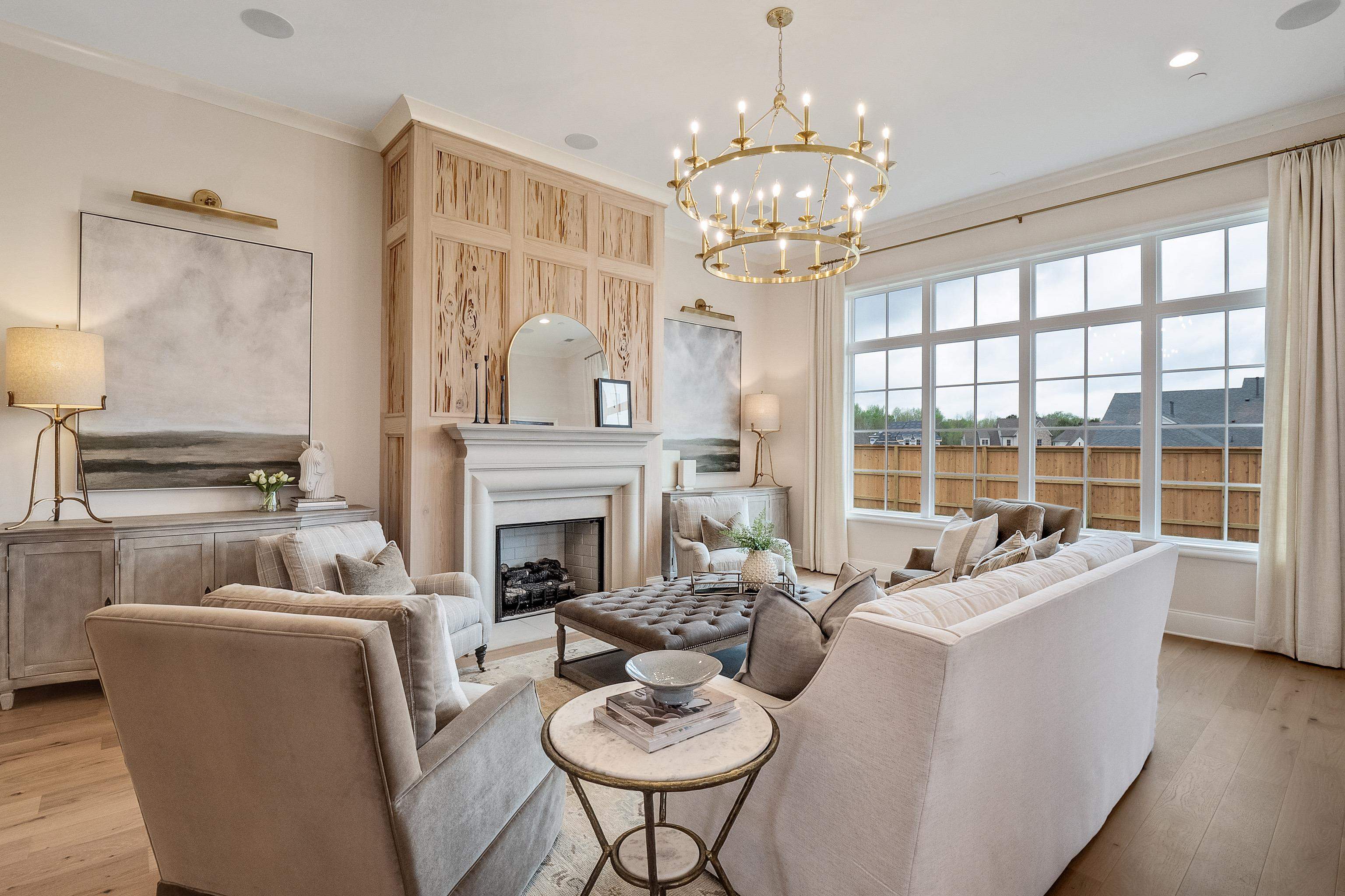356 River Branch Drive Collierville, TN 38017 - Photo 30 of 31 a living room with furniture a chandelier and a fireplace