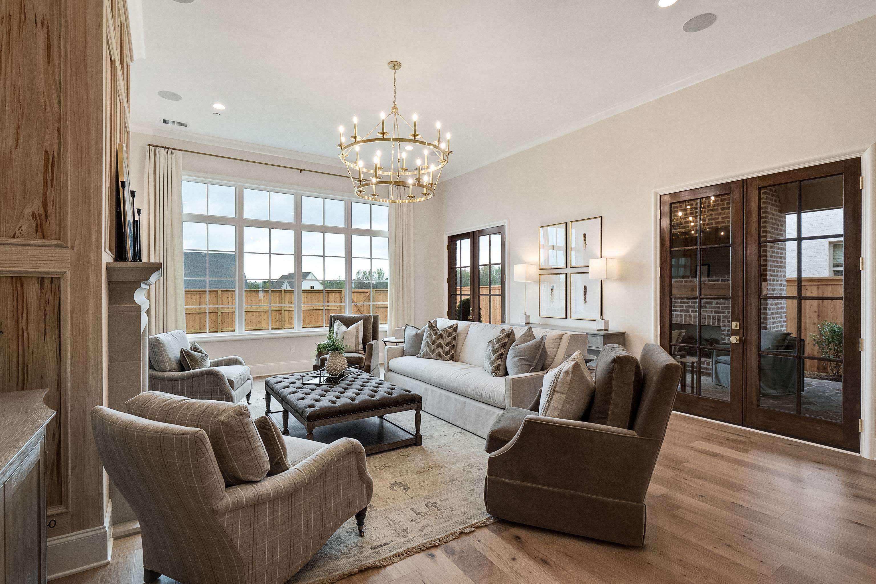 356 River Branch Drive Collierville, TN 38017 - Photo 5 of 31 a living room with furniture and a chandelier