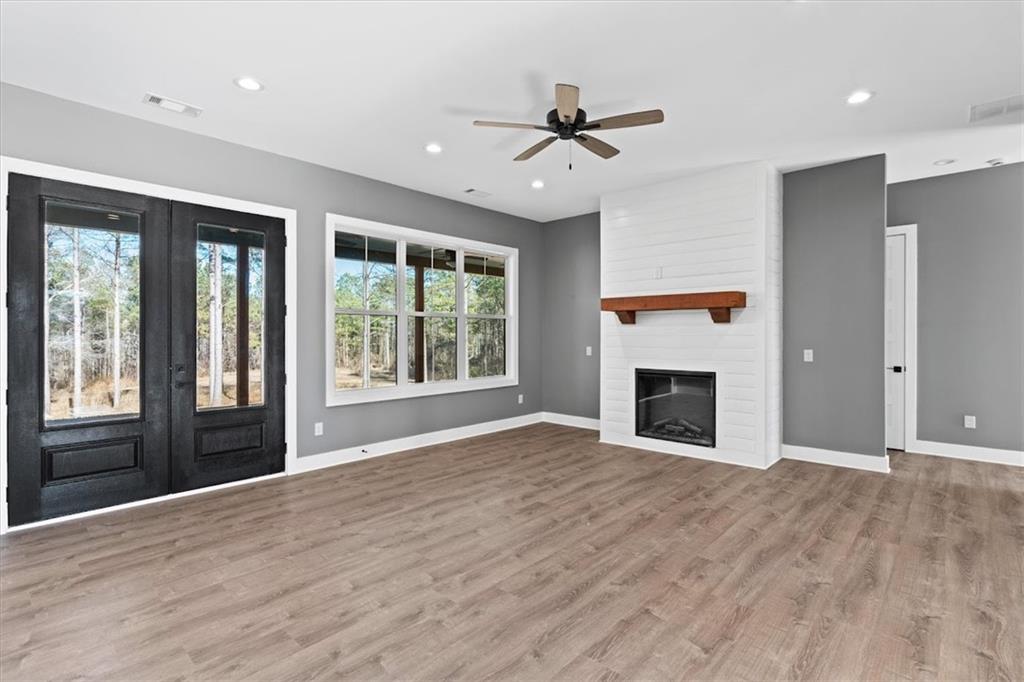 1374 Morgan Road Bremen, GA 30110 - Photo 13 of 50 a view of an empty room with a window and wooden floor