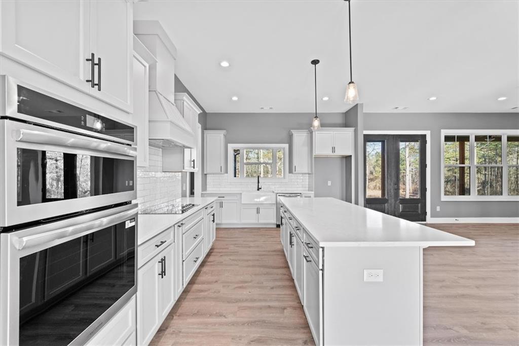 1374 Morgan Road Bremen, GA 30110 - Photo 19 of 50 a large white kitchen with stainless steel appliances