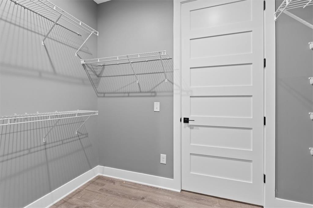1374 Morgan Road Bremen, GA 30110 - Photo 29 of 50 a view of walk in closet with empty racks