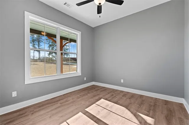 a view of hallway with wooden floor