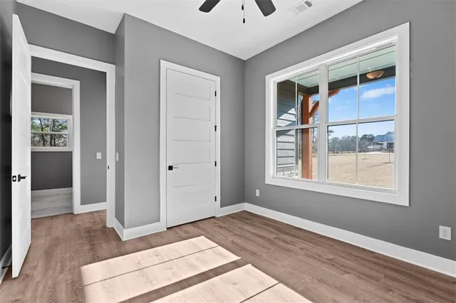 a view of entryway with wooden floor and stairs