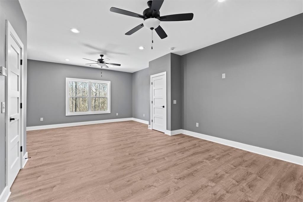 1374 Morgan Road Bremen, GA 30110 - Photo 41 of 50 a view of an empty room with a window and a ceiling fan