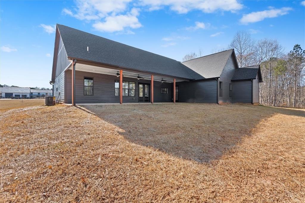 1374 Morgan Road Bremen, GA 30110 - Photo 43 of 50 a front view of house with yard and trees in the background