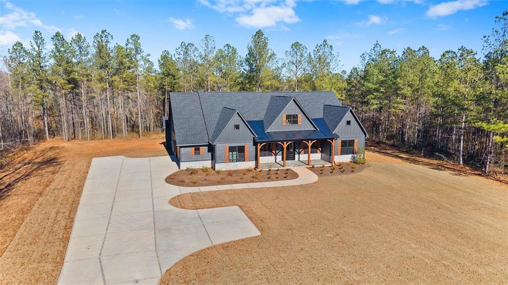 1374 Morgan Road Bremen, GA 30110 - Photo 5 of 50 an aerial view of a house with swimming pool and large trees