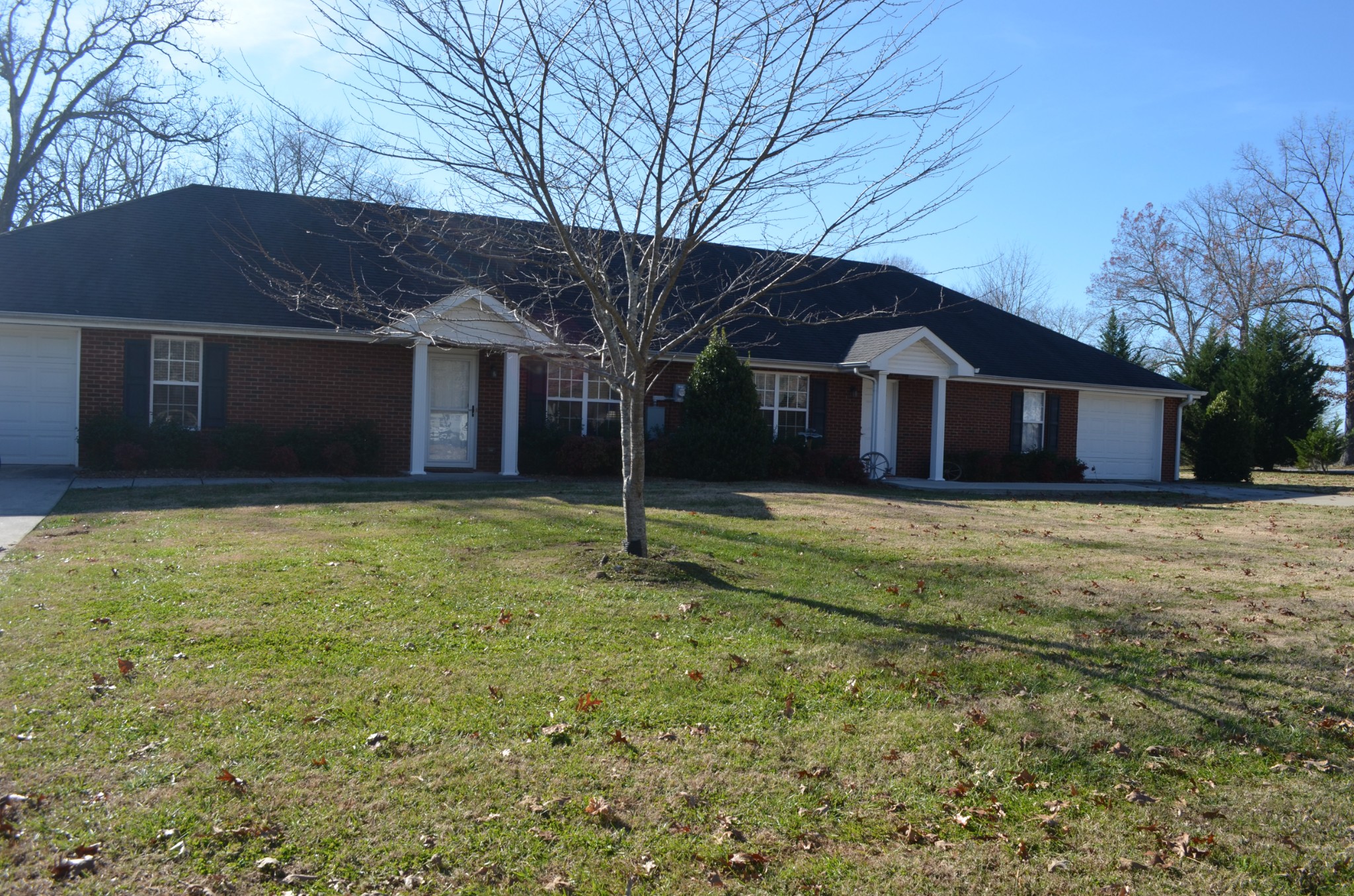 a front view of a house with a yard