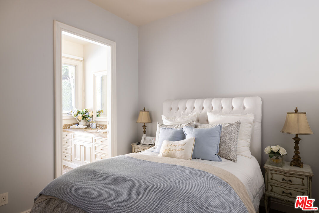 1160 Chantilly Road Los Angeles, CA 90077 - Photo 17 of 32 a bedroom with a bed and a window