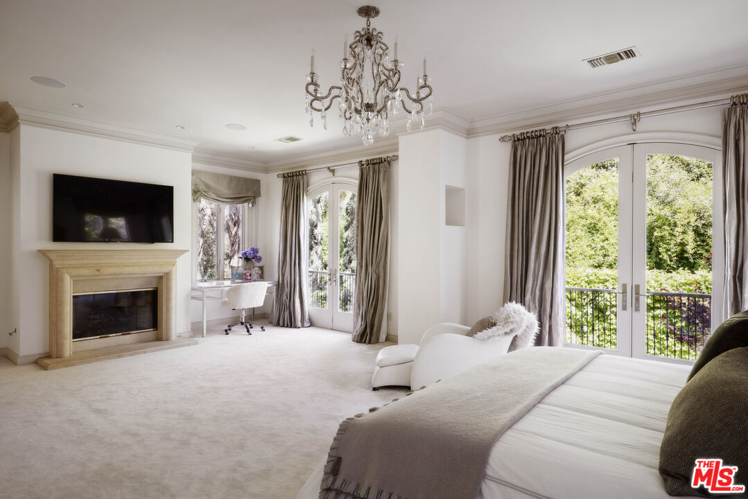 1160 Chantilly Road Los Angeles, CA 90077 - Photo 20 of 32 a bedroom with a bed and a flat screen tv