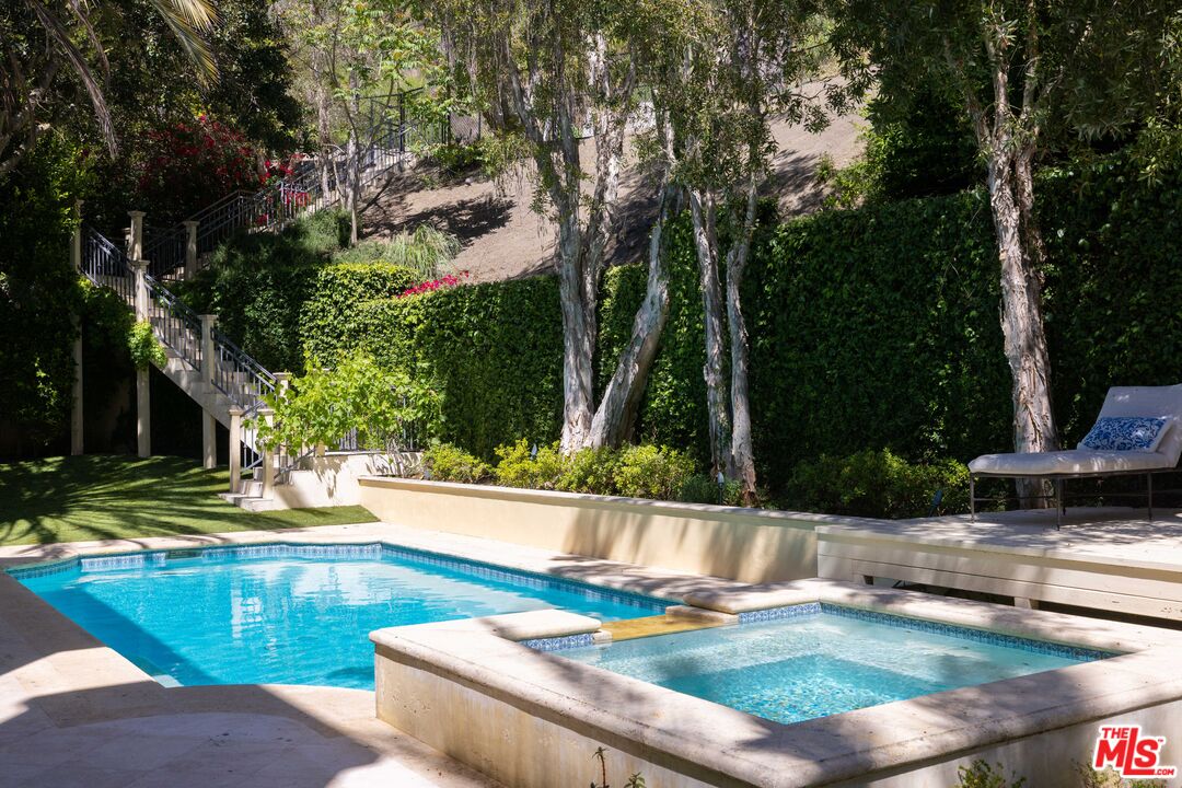1160 Chantilly Road Los Angeles, CA 90077 - Photo 28 of 32 a view of a house with swimming pool
