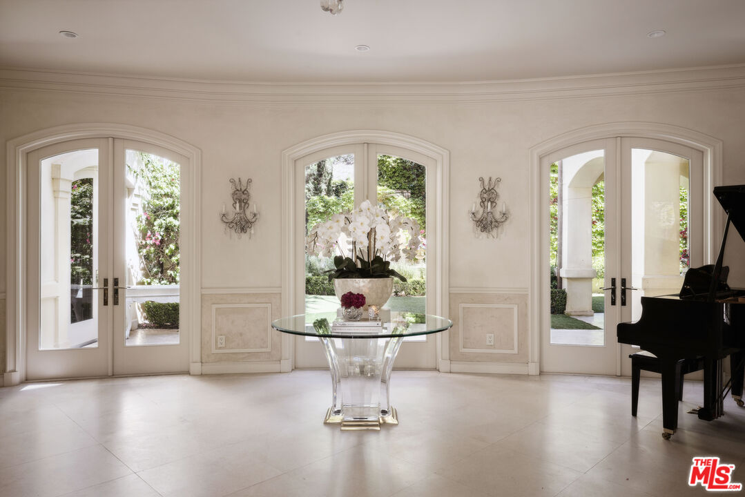 1160 Chantilly Road Los Angeles, CA 90077 - Photo 3 of 32 a living room with furniture and a large window