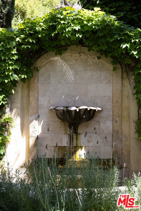 1160 Chantilly Road Los Angeles, CA 90077 - Photo 31 of 32 a aerial view of a house with a yard and large trees