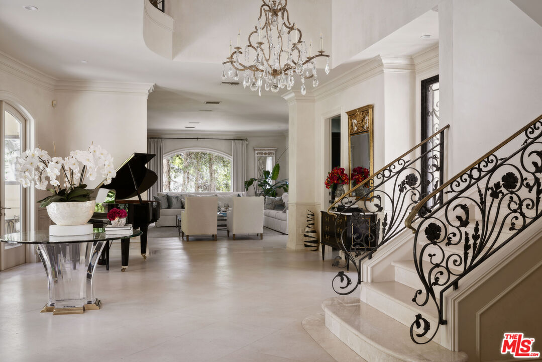 1160 Chantilly Road Los Angeles, CA 90077 - Photo 4 of 32 a living room with furniture and a chandelier