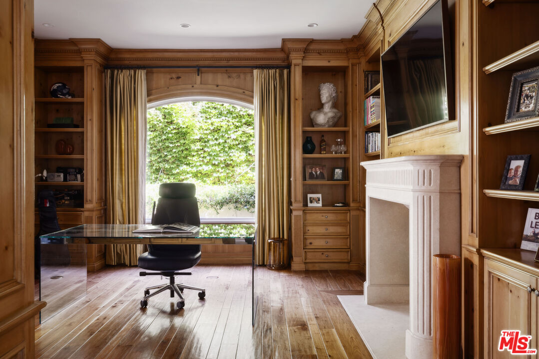 1160 Chantilly Road Los Angeles, CA 90077 - Photo 6 of 32 a living room with furniture and a fireplace