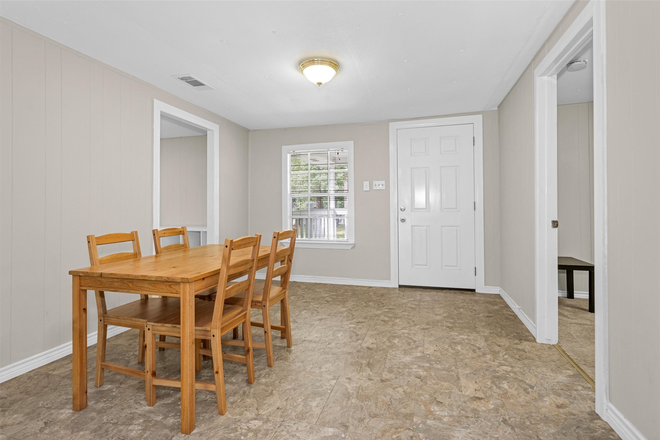 99 Main Street Huntsville, TX 77340 - Photo 9 of 47 Just off the entry is the dining room leading into the living room.