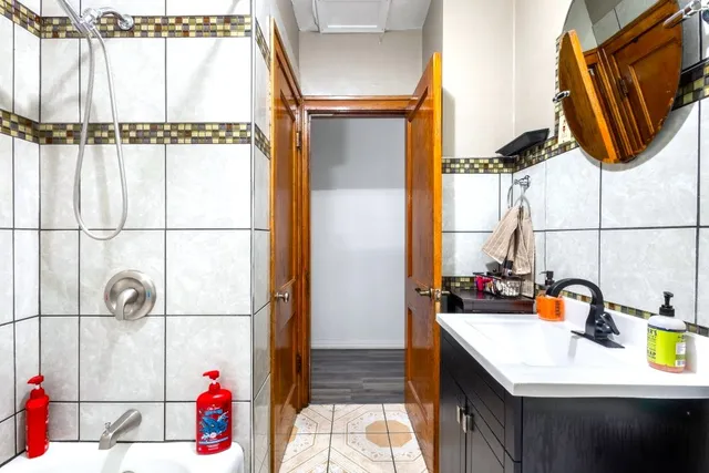 a bathroom with a sink and a mirror