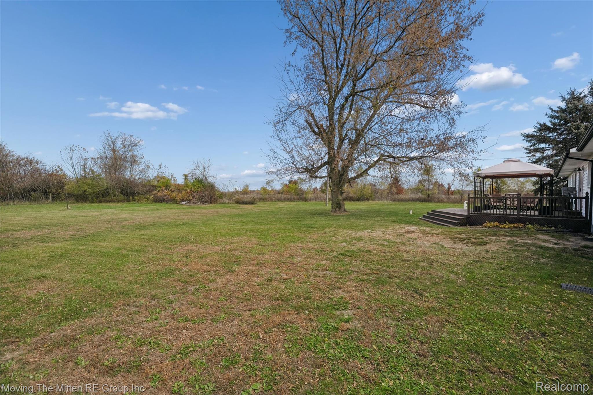 12000 Plank Road Milan, MI 48160 - Photo 36 of 49 View of grassy yard featuring a gazebo and a deck