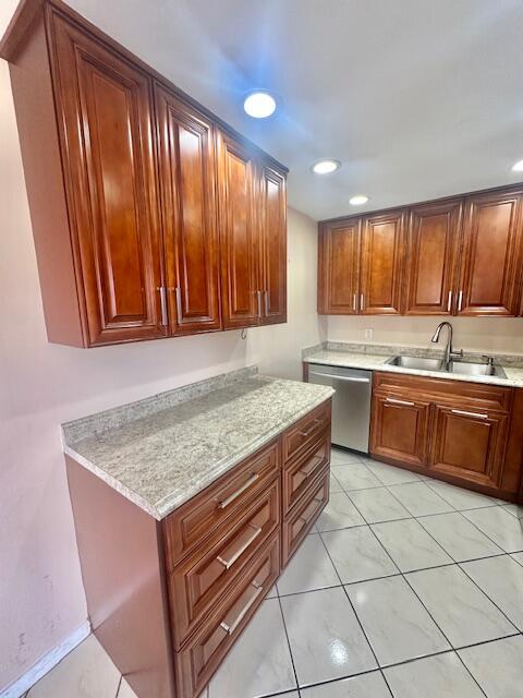 69 Dorset B Boca Raton, FL 33434 - Photo 4 of 25 a kitchen with a stove sink and cabinets