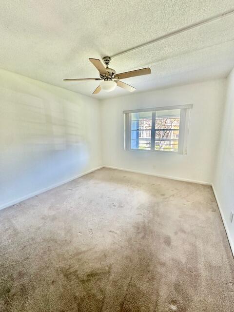 69 Dorset B Boca Raton, FL 33434 - Photo 8 of 25 a view of an empty room with a window