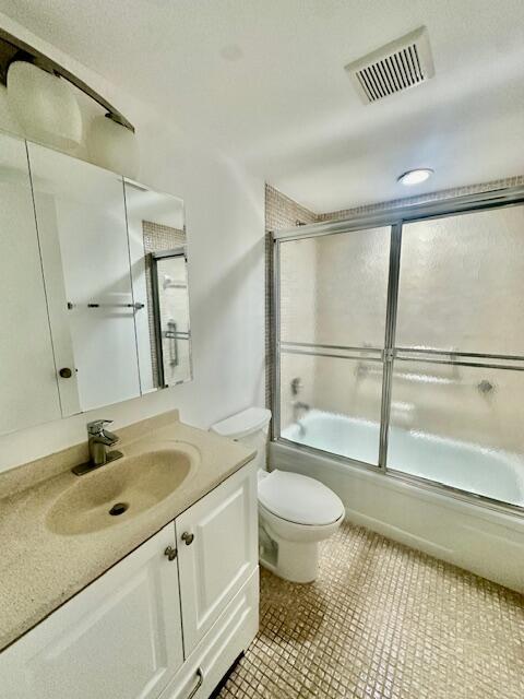 69 Dorset B Boca Raton, FL 33434 - Photo 9 of 25 a bathroom with a sink toilet a mirror and shower
