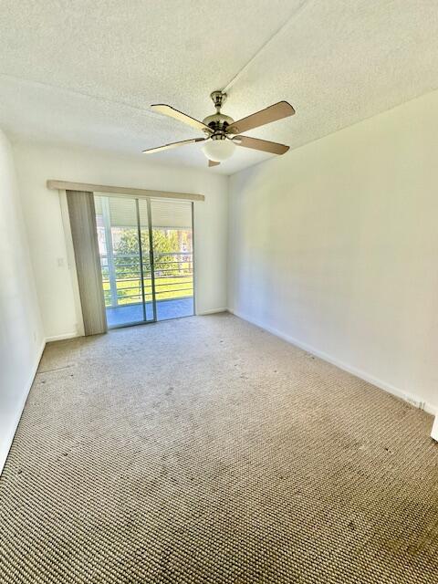 69 Dorset B Boca Raton, FL 33434 - Photo 10 of 25 an empty room with windows