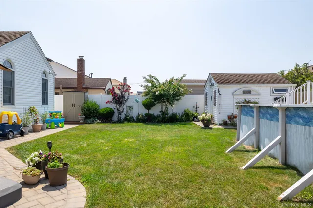 a house view with a backyard space