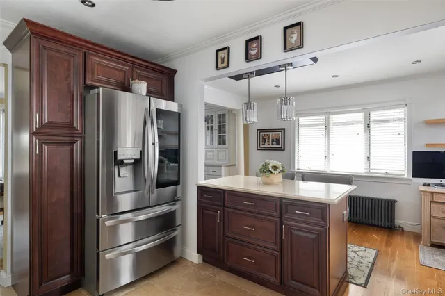 a kitchen with a refrigerator and cabinets