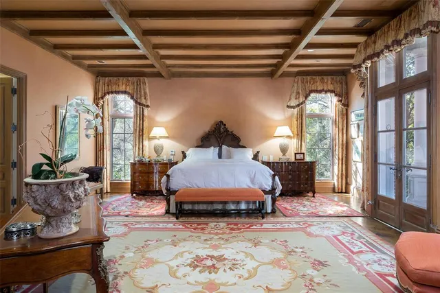 a spacious bedroom with a bed window and walk in closet